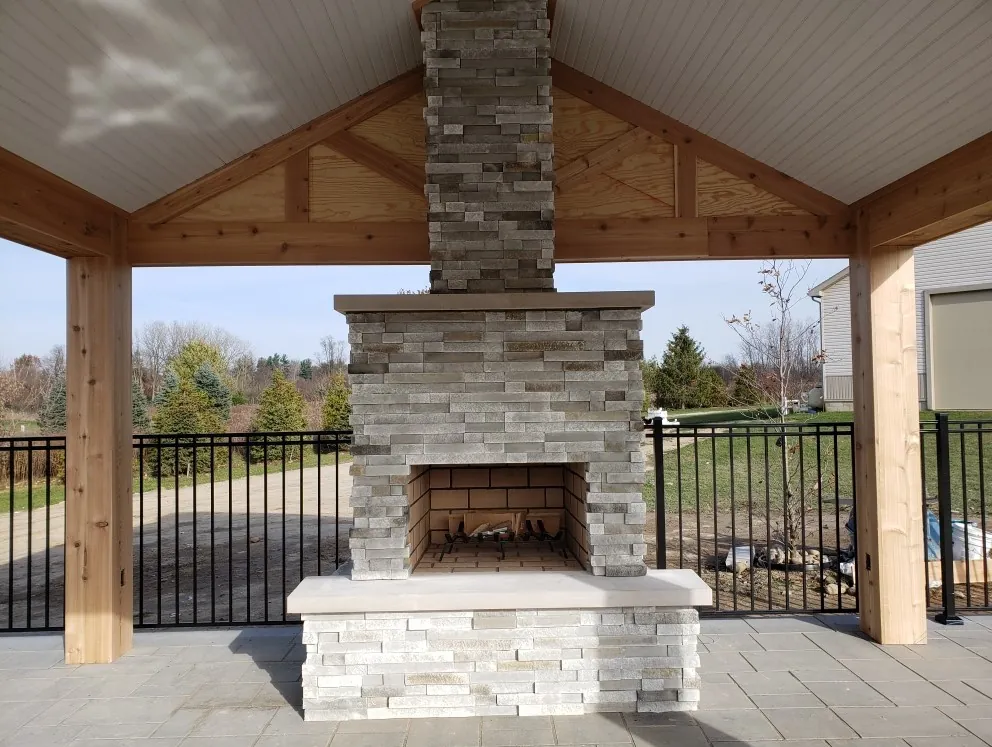 Covered pavilion with a stone fireplace