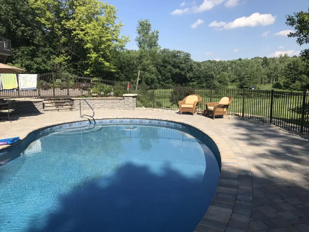In-ground pool with a paver surround